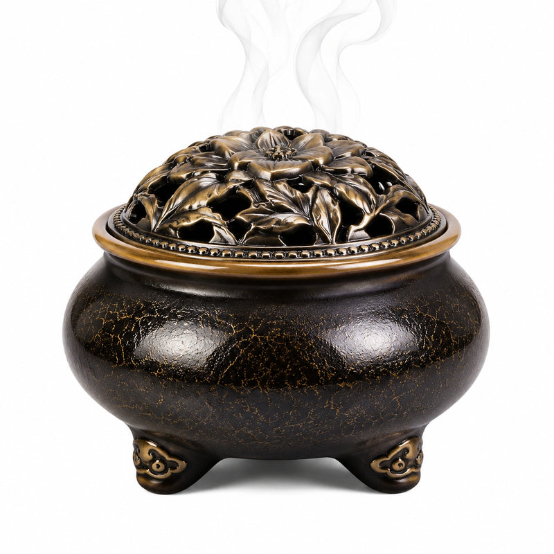 Bruciatore di incenso in ceramica 16 cm nero e bronzo con coperchio traforato floreale